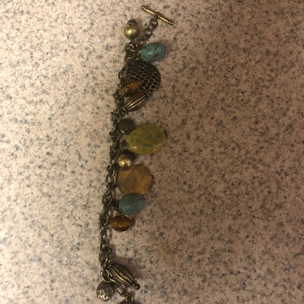 Thirteen charmed costume bronze bracelet.